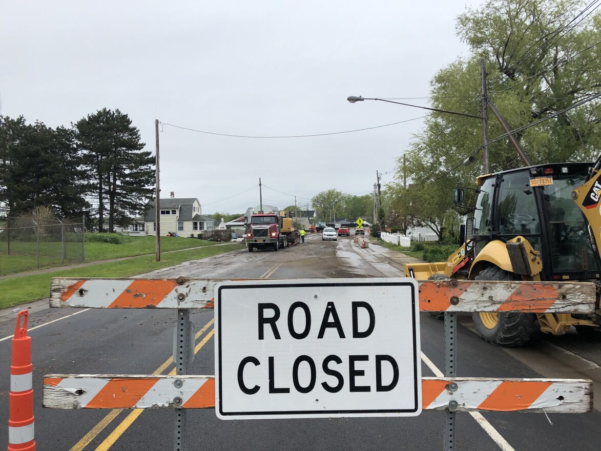 The water has receded, but Edgemere Drive is still closed to through traffic due to debris and flood damage.
